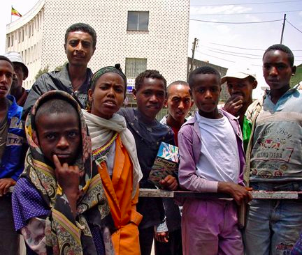 Curious teenagers studying American tourists in downtown Addis Ababa, Ethiopia